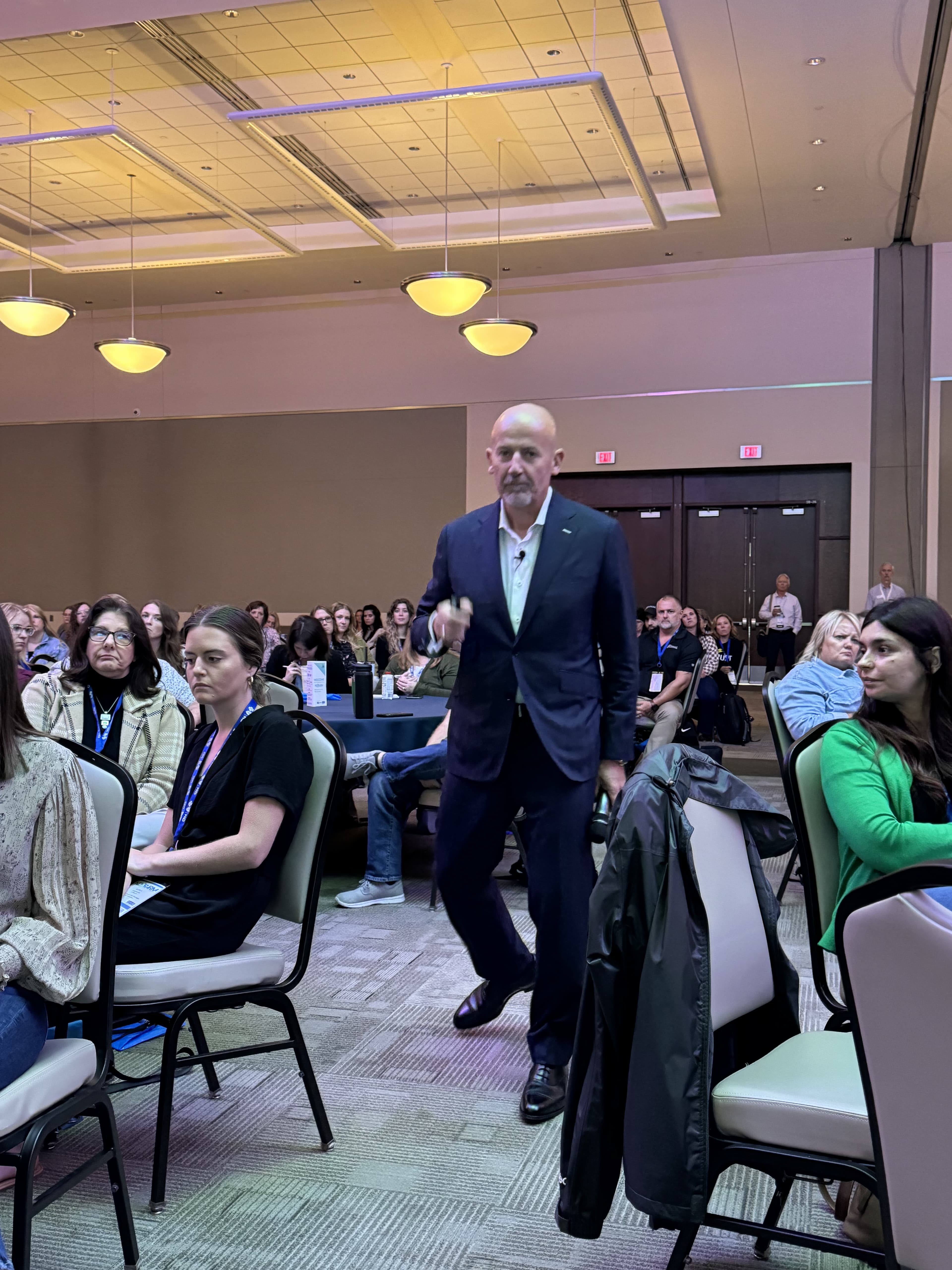 Steve Lowisz walking through the audience
