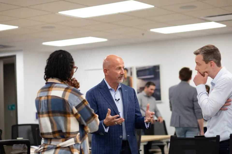 Steve Lowisz in a small-group conversation with two workshop participants