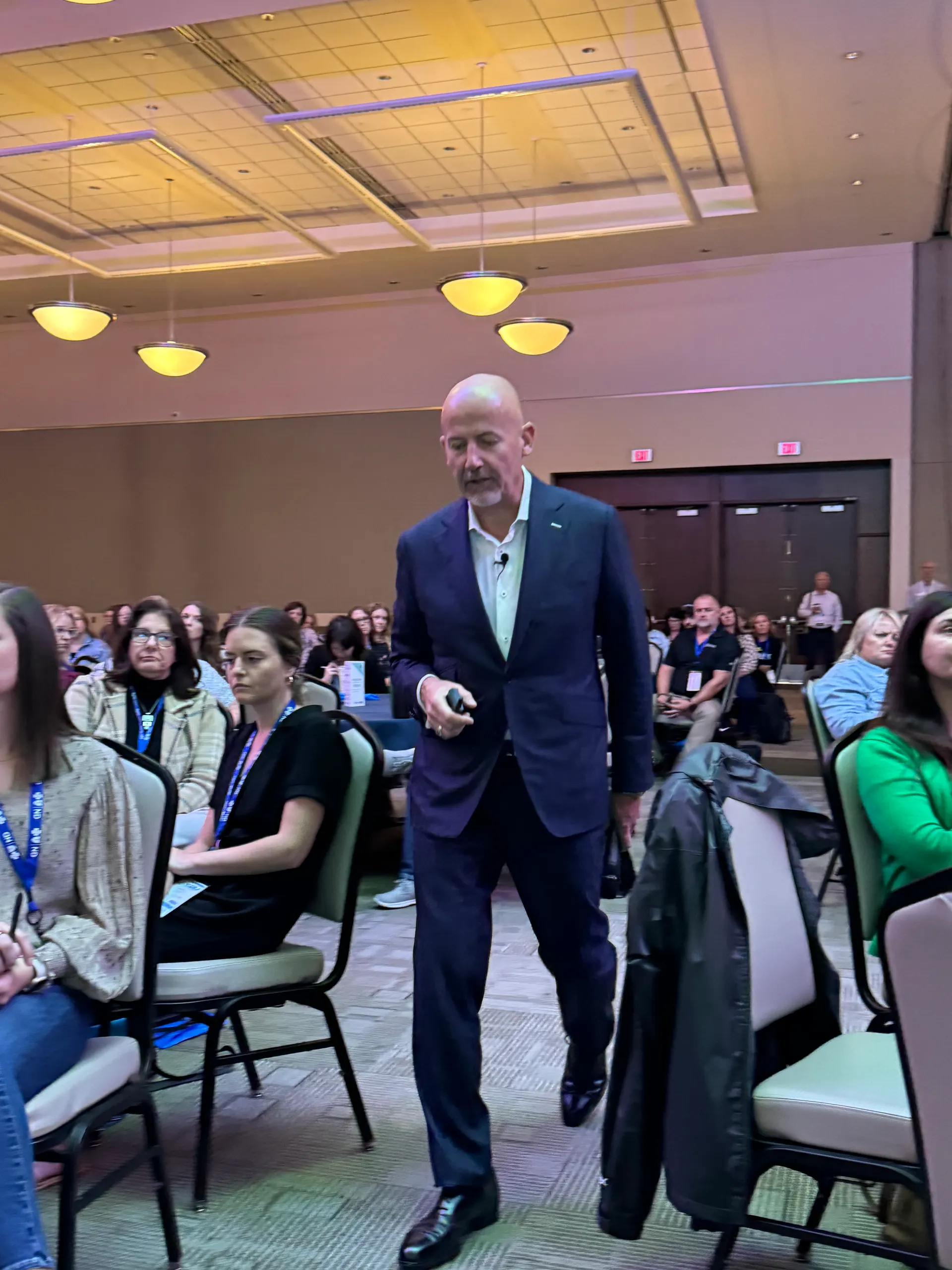 Steve Lowisz delivering a keynote on stage